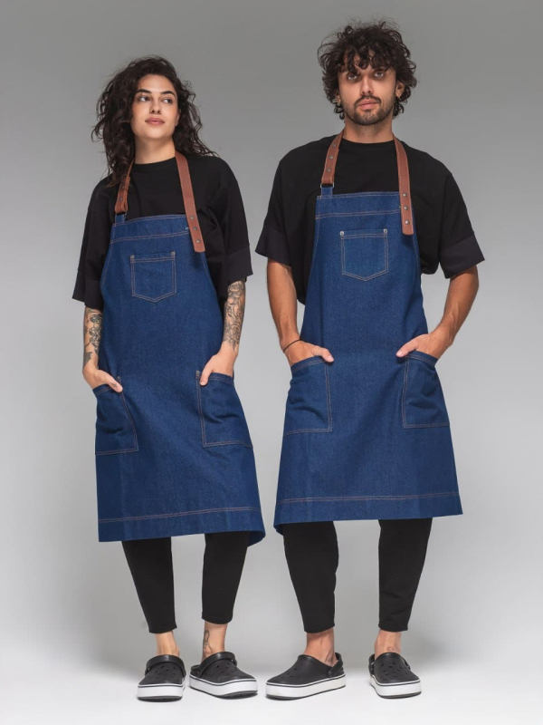 Blue denim apron with a cognac-coloured leather strap