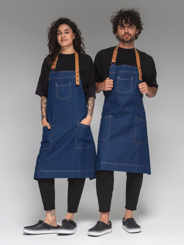 Blue denim apron with a chocolate-and-orange leather strap